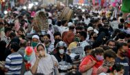 FILE PHOTO: People wearing protective masks crowd a marketplace amidst the spread of COVID-19 in Mumbai, India, March 22, 2021. REUTERS/Niharika Kulkarni