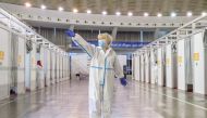 A nurse invites people to the booths to receive AstraZeneca vaccine against the coronavirus disease (COVID-19) in Belgrade, Serbia, March 25, 2021. REUTERS/Marko Djurica