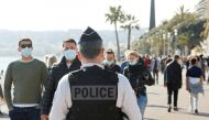 FILE PHOTO: A french police officer patrols on the Promenade des Anglais during the third lockdown imposed to slow the rate of the coronavirus disease (COVID-19) contagion, in Nice, France, March 27, 2021. REUTERS/ Eric Gaillard/File Photo
