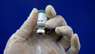 A paramedic prepares a dose of the coronavirus disease (COVID-19) vaccine before administering it to a resident, at a vaccination center in Karachi, Pakistan April 1, 2021. REUTERS/Akhtar Soomro
