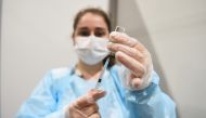 A medical worker fills a syringe with a dose of AstraZeneca's coronavirus disease (COVID-19) vaccine at the Belexpo vaccination centre, as Serbia started to immunise business people across the region, in Belgrade, Serbia, March 27, 2021. REUTERS/Zorana Je