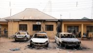 Burnt vehicles are seen outside the Nigeria police force Imo state command headquarters after gunmen attacked and set properties ablaze in Imo State, Nigeria April 5, 2021. Picture taken April 5, 2021. David Dosunmu/Handout via Reuters