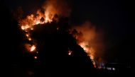 A hill burns during a forest fire in Makwanpur, outskirts of Kathmandu, as forest fires have raged many areas in Nepal contributing to worst air quality in the bowl shaped Kathmandu, Nepal April 8, 2021. REUTERS/Navesh Chitrakar
