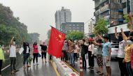 File photo: Anti-coup protesters hold a Chinese flag before burning it down during a demonstration against China in Yangon, Myanmar April 5, 2021. Reuters/Stringer/File Photo