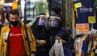 Iranian women wear protective face shields and masks as they walk in Tehran Bazaar in Tehran, Iran April 6, 2021.