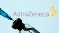 A vial and sryinge are seen in front of a displayed AstraZeneca logo in this illustration taken January 11, 2021. REUTERS/Dado Ruvic/Illustration/File Photo