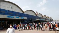People wearing protective masks stand in line at a railway station amidst the spread of the coronavirus disease (COVID-19) in Mumbai, India, 9 April, 2021. REUTERS/Francis Mascarenhas