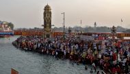 Devotees gather to take a holy dip in the waters of river Ganges during Kumbh Mela, or the Pitcher Festival, amidst the spread of the coronavirus disease (COVID-19), in Haridwar, India, April 12, 2021. REUTERS/Anushree Fadnavis
