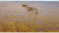 One Mile Jetty is seen destroyed by tropical cyclone Seroja in Carnarvon, Australia April 11, 2021, in this still image taken from drone video footage obtained from social media by Reuters on April 12, 2021. Courtesy of Bill Kent/via REUTERS
