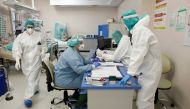 Medical staff members work inside the coronavirus disease (COVID-19) intensive care ward at the Stefan Zeromski hospital in Krakow, Poland, April 14, 2021. Picture taken April 14, 2021. REUTERS/Kacper Pempel
