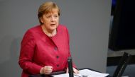 German Chancellor Angela Merkel speaks during a session of the lower house of parliament Bundestag debating the coronavirus disease (COVID-19) measures, in Berlin, Germany, April 16, 2021. REUTERS/Michele Tantussi
