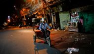 File photo: A man rides a rickshaw on a deserted street during a curfew to limit the spread of the coronavirus disease (COVID-19), in New Delhi, India, April 6, 2021. Reuters/Adnan Abidi/File Photo