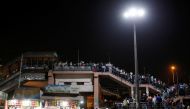 Migrant workers arrive at a bus station to board buses to return to their villages after Delhi government ordered a six-day lockdown to limit the spread of the coronavirus disease (COVID-19), in Ghaziabad on the outskirts of New Delhi, India, April 19, 20