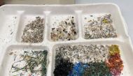 Assorted microplastics are seen in a container at Macquarie University in Sydney, Australia, April 15, 2021. Picture taken April 15, 2021. REUTERS/Jill Gralow