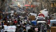 FILE PHOTO: People walk at a crowded market amidst the spread of the coronavirus disease (COVID-19), in the old quarters of Delhi, India, April 6, 2021. REUTERS/Anushree Fadnavis/File Photo
