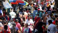 People are seen at a crowded marketplace in a slum area, amidst the spread of the coronavirus disease (COVID-19), in Mumbai, India, April 23, 2021. REUTERS/Niharika Kulkarni

