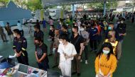 People queue to be tested for the coronavirus disease (COVID-19), as the country deals with a fresh wave of infections after tackling earlier outbreaks, in Bangkok, Thailand April 16, 2021. REUTERS/Athit Perawongmetha/File Photo