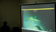 The military personnel display a video showing what is believed to be the sunken Indonesian Navy KRI Nanggala-402 submarine during a media conference at I Gusti Ngurah Rai Airport in Bali, Indonesia, April 25, 2021. Reuters/Johannes P. Christo