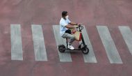 A man wearing a face mask rides a scooter amid the coronavirus disease (COVID-19) outbreak, in Bangkok, Thailand, April 23, 2021. REUTERS/Soe Zeya