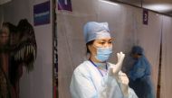 Medical workers are seen in a vaccination centre located at a shopping and entertainment mall in Almaty, Kazakhstan April 27, 2021. Kazakhstan started using its own domestically-developed QazCovid-in vaccine against the coronavirus disease (COVID-19) for 