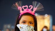 A girl wearing a mask and 