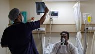 A doctor checks an X-ray of a patient suffering from the coronavirus disease (COVID-19) inside a COVID-19 ward of a hospital in New Delhi, India, May 1, 2021. REUTERS/Danish Siddiqui