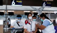 People get vaccinated against the coronavirus disease (COVID-19) at Suvarnabhumi airport in Bangkok, Thailand April 28, 2021. REUTERS/Jorge Silva/File Photo