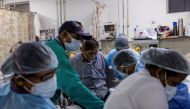 :A patient suffering from the coronavirus disease (COVID-19) receives treatment inside the casualty ward at a hospital in New Delhi, India, May 1, 2021. REUTERS/Danish Siddiqui

