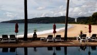 An empty hotel and beach which have opened for visitors is seen in Karon, Phuket Island, Thailand March 31, 2021. Picture taken March 31, 2021. REUTERS/Jorge Silva/File Photo
