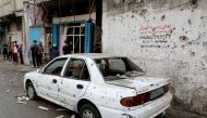 A damaged car is seen at the site where Palestinians were killed in the northern Gaza Strip on May 10, 2021. (REUTERS)