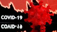 FILE PHOTO: A 3D-printed coronavirus model is seen in front of a stock graph and the words Covid-19 on display in this illustration taken March 25, 2020. REUTERS/Dado Ruvic/Illustration/File Photo
