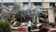 A Palestinian man looks on as he stands at the site of an Israeli air strike, in Gaza City May 11, 2021. Reuters/Suhaib Salem
 