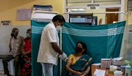 Minakshamma, 68, receives a dose of COVISHIELD, a coronavirus disease (COVID-19) vaccine manufactured by Serum Institute of India, at a vaccination centre in Bengaluru, May 13, 2021. REUTERS/Samuel Rajkumar