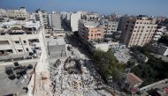 A general view as rescue workers search for victims amid rubble at the site of Israeli air strikes, in Gaza City May 16, 2021. REUTERS/Mohammed Salem
 