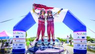 Nasser Al Attiyah and Matthieu Baumel celebrate after winning the Andalucia Rally yesterday.
