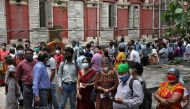 File photo: People wearing protective face masks wait to receive their second dose of COVISHIELD, a coronavirus disease (COVID-19) vaccine manufactured by Serum Institute of India, outside a vaccination centre in Kolkata, India, May 12, 2021. Reuters/Rupa