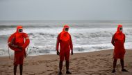 Members of the National Disaster Response Force (NDRF) stand guard along a shore ahead of Cyclone Tauktae in Veraval in the western state of Gujarat, India, May 17, 2021. Reuters/Amit Dave
