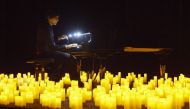 French pianist Eric Artz performs Japanese animated theme songs illuminated with hundreds of candles as during easing of lockdown measures against the coronavirus disease (Covid-19) outbreak during the Candlelight series in Les Salons in Geneva, Switzerla