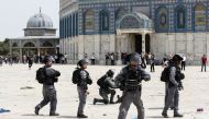 Israeli police stand in position at the compound that houses Al-Aqsa Mosque, known to Muslims as Noble Sanctuary and to Jews as Temple Mount, in Jerusalem's Old City May 21, 2021. REUTERS/Ammar Awad
