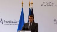 French President Emmanuel Macron addresses delegates after laying a wreath on a mass grave containing the remains of the 1994 Rwandan genocide victims at the Kigali Genocide Memorial Center at Gisozi in Kigali, Rwanda May 27, 2021. REUTERS/Jean Bizimana