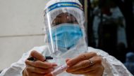 File photo: A health worker labels a test-sample tube during the coronavirus outbreak in Hanoi, Vietnam, January 29, 2021. Reuters/Kham/File Photo
 