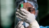 A health official draws a dose of the AstraZeneca's COVID-19 vaccine manufactured by the Serum Institute of India, at Infectious Diseases Hospital in Colombo, Sri Lanka January 29, 2021. REUTERS/Dinuka Liyanawatte/File Photo