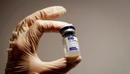 A medical specialist holds a vial of Sputnik V vaccine against the coronavirus in a department store in Moscow, Russia, January 18, 2021 REUTERS/Shamil Zhumatov/File Photo