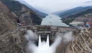 The Baihetan hydropower plant is seen in operation on the border between Qiaojia county of Yunnan province and Ningnan county of Sichuan province, China June 28, 2021. Picture taken with a drone. cnsphoto via REUTERS