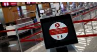 A social distancing sign is seen before the Turkish Airlines check-in counters at the international departure terminal of the Istanbul Airport amid the coronavirus disease (COVID-19) outbreak, in Istanbul, Turkey June 19, 2020. REUTERS/Murad Sezer