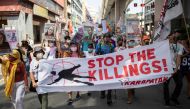 Protesters calling to stop extra-judicial killings march towards the presidential Malacanang Palace during a protest to commemorate President Rodrigo Duterte's final year in office, in Manila, Philippines, June 30, 2021. REUTERS/Eloisa Lopez