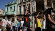 People shout slogans against the government during a protest against and in support of the government, amidst the coronavirus disease (COVID-19) outbreak, in Havana, Cuba July 11, 2021. REUTERS/Alexandre Meneghin

