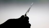 A healthcare worker prepares a dose of China's Sinovac Biotech vaccine for the coronavirus disease (COVID-19) at a drive-thru vaccination station, in Jakarta, Indonesia, March 5, 2021. REUTERS/Willy Kurniawan/File Photo/File Photo