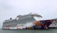 A cruise ship is docked at harbour after turning back due to positive coronavirus disease (COVID-19) case on board, in Singapore July 14, 2021. REUTERS/Chen Lin