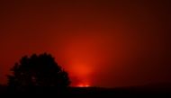 The Bootleg Fire glows in the distance, near Beatty, Oregon, U.S., July 13, 2021. Picture taken July 13, 2021. REUTERS/Mathieu Lewis-Rolland
